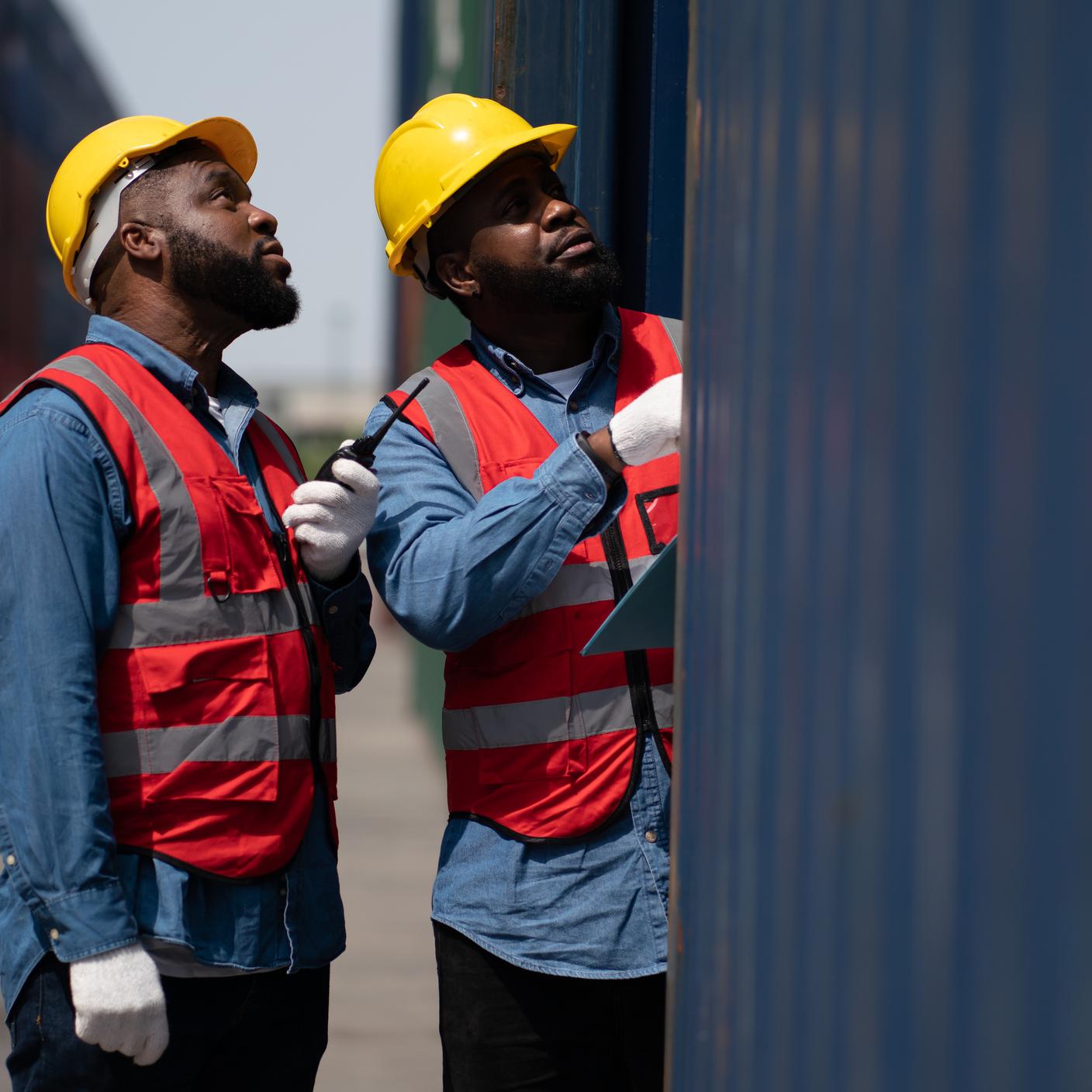 Adults work professionally transporting goods.man business engineer in container transportation industry.Shipping Container Distribution Warehouse Technology.