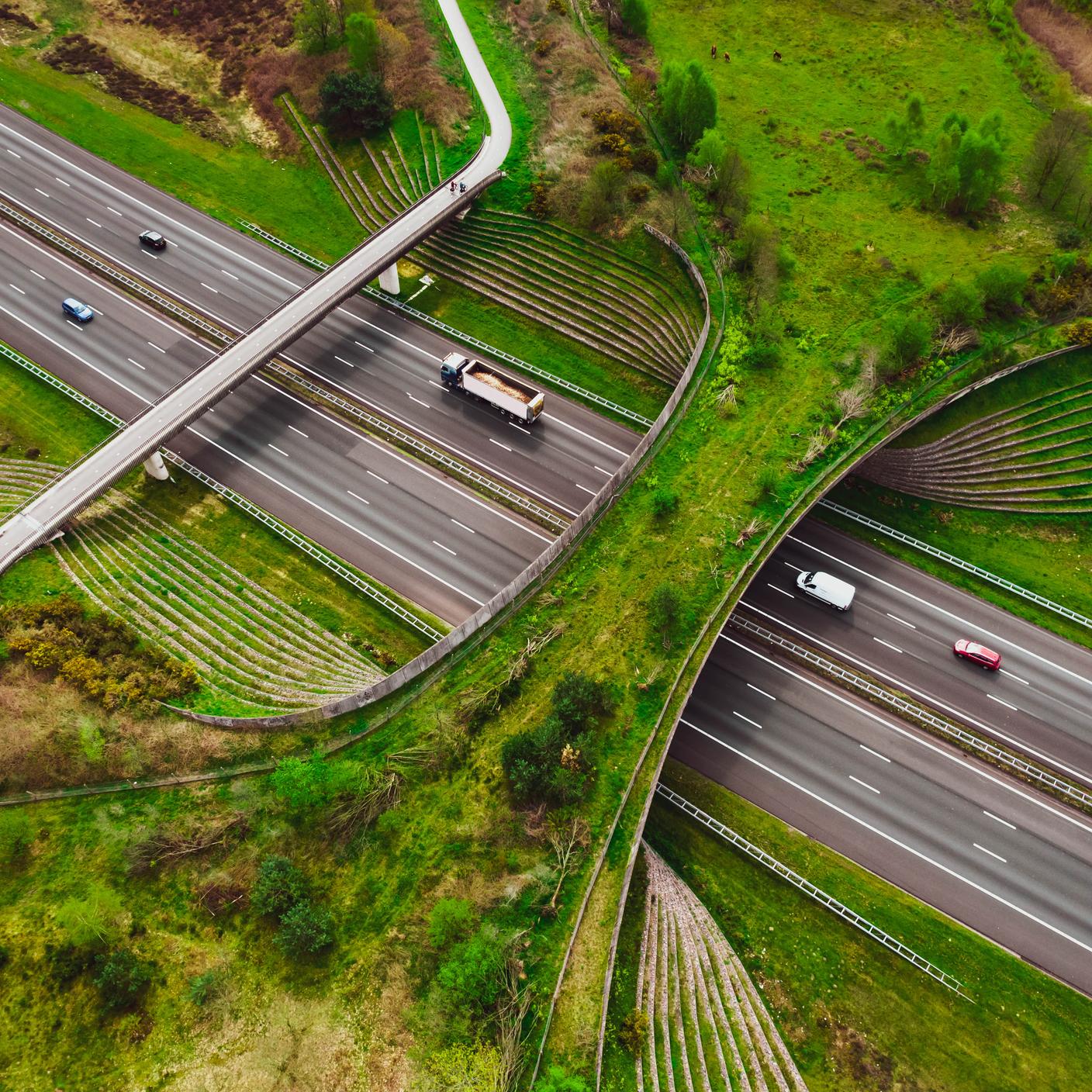 multiple highway with bicycle lane bridge and people commuting